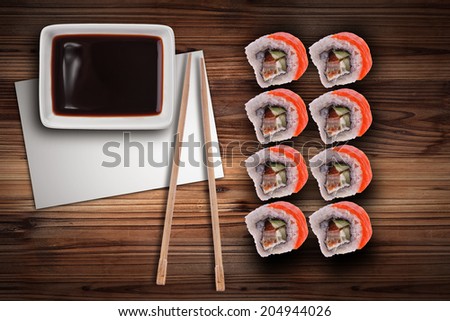 Maki Sushi set Japanese cuisine with sushi rice and fresh salmon on wooden background