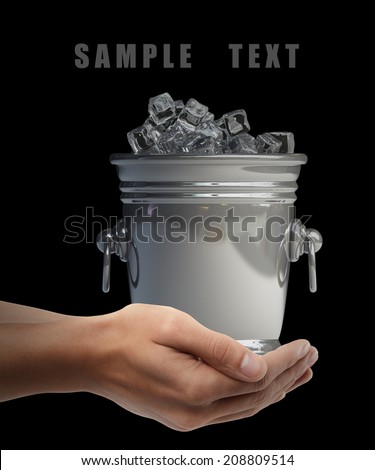 full of ice bucket. Man hand holding object  isolated on black background. High resolution