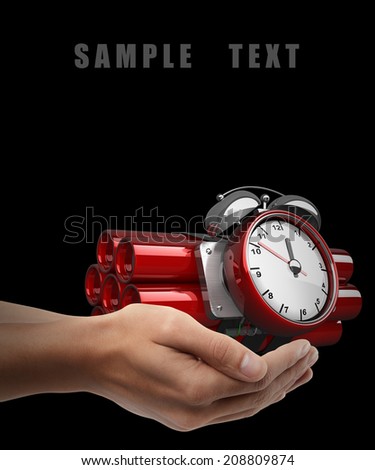 Bomb with clock timer. Man hand holding object isolated on black background. High resolution