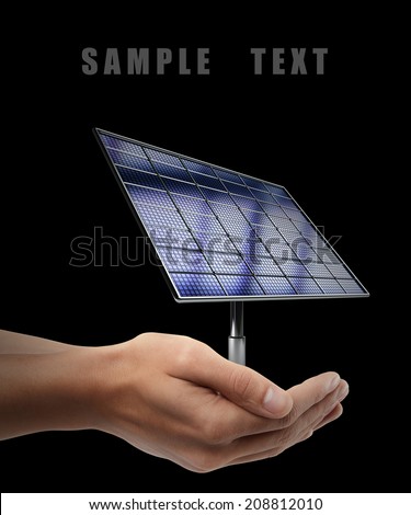 Solar battery panel. Man hand holding object  isolated on black background. High resolution