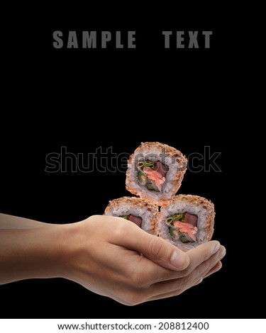Man hand holding sushi isolated on back background. High resolution