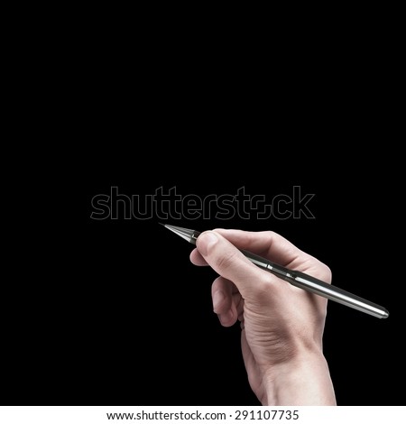 male hand with pen isolated on black background