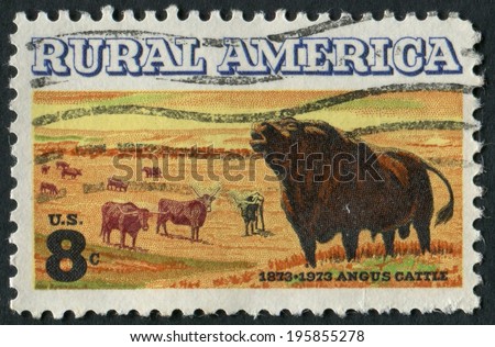 United States of America-Circa 1973: A stamp honoring Rural America showing Angus and Long Horn cattle.