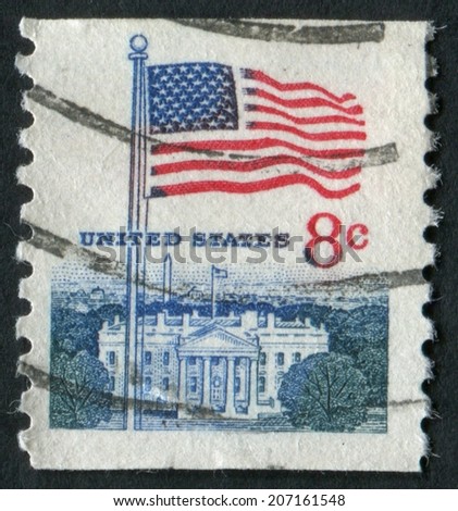 United States of America-Circa 1971: a stamp issued showing the American Flag with the United States White House in the background.