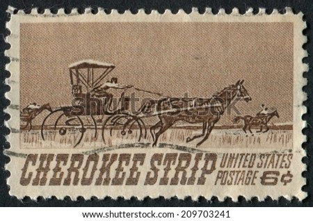 United States of America-Circa 1968: a stamp issued to commemorate the land run along the Cherokee Strip in what would become Oklahoma.
