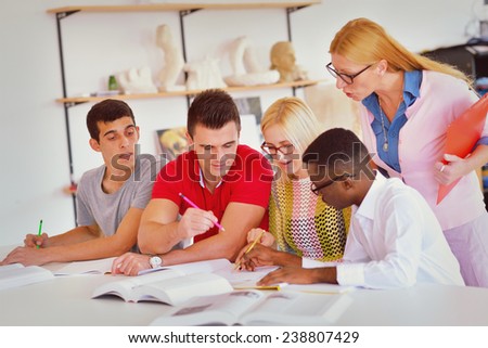Group of students studying together in a classroom