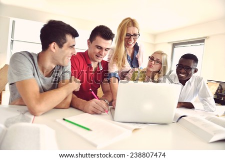 Group of students studying together in a classroom