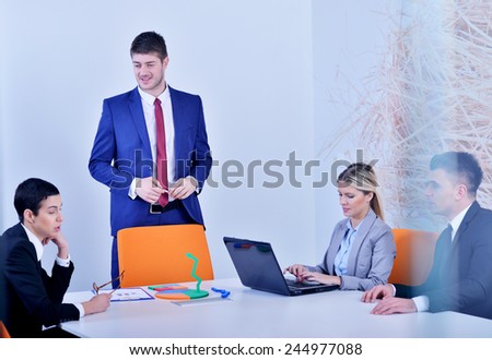 Image of business partners discussing documents and ideas at meeting
