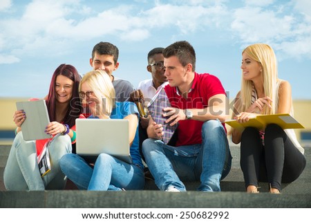 Friends and education, group of university students studying, reviewing homework and preparing test