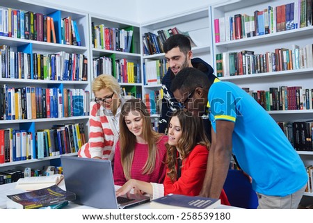 Group of students learning in the library and enjoy it