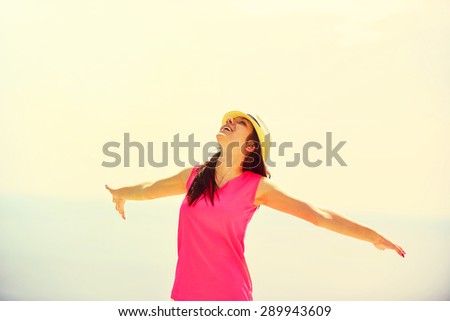 Beach vacation. Hot beautiful woman in  enjoying looking view of beach sea on hot summer day.