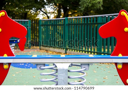 Empty playground in England during fall season/Empty playground/Outdoors