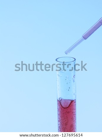 Pipette dropping liquid in test tube/Test tube/Science