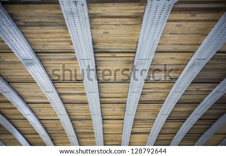 Curved steel bars and wooden planks pattern/Pattern/architecture detail