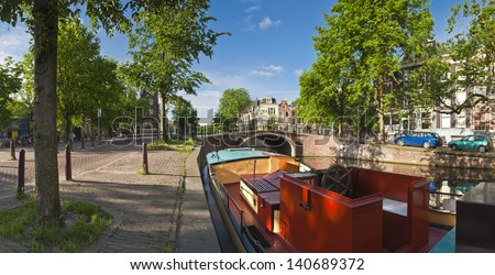 Pretty dutch doll houses reflected in the tranquil canals of Amsterdam.