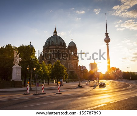 The Berlin Cathedral And Fernsehturn Television Tower At First Light Standing Side By Side As Respected Icons Of The City.