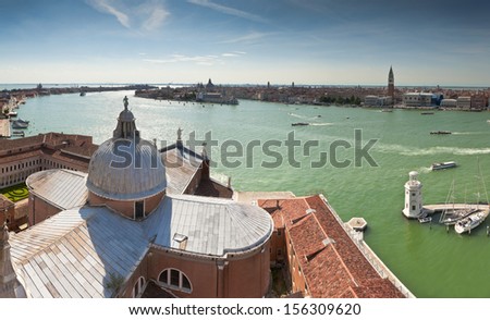 San Giorgio Maggiore island and church looking towards San Marco square, Santa Maria Della Salute with pleasure boats lazily cruising the canals of Venice, Italy.
