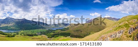 Mountain peaks and blue sky in Eskdale valley, Lake District, UK.