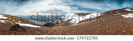 Dramatic view of beautiful Wester Ross snowcapped mountains from Beinn Alligin, Torridon, Scotland.