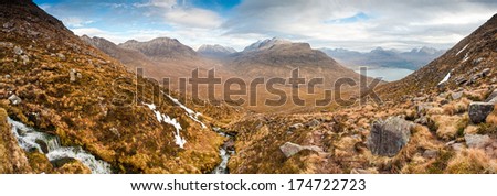 Dramatic view of beautiful Wester Ross snowcapped mountains from Beinn Alligin, Torridon, Scotland.