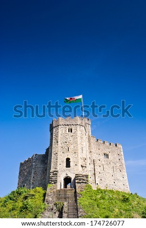 Cardiff Castle, welsh flag flying, situated within beautiful parklands in the heart of the city.