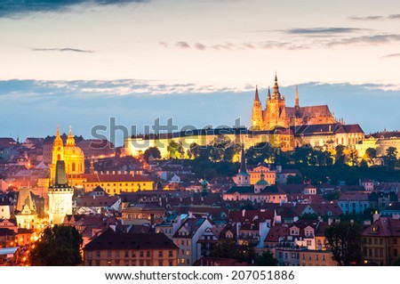 Pretty night time illuminations of Hradcany Castle, St Vitus Cathedral (1714) and city rooftops in the magical city of Prague.