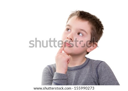 Young boy pushing the limits of his thought process, isolated on white