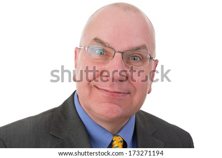 Businessman with a sardonic quizzical expression raising his eyebrows in disbelief as he smiles at the camera, head and shoulders portrait on white