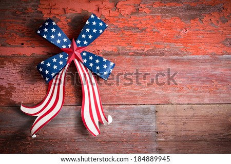 Independence Day 4th July emblem with a blue stars bow and curly red and white ribbon to celebrate the Declaration of Independence of the United States of America, copy space on the right
