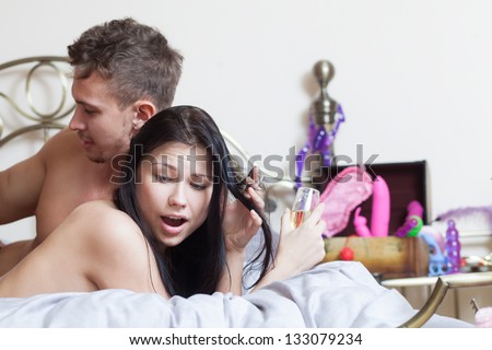 Close Up Of A Sexy Couple Kissing And Playing In Bed
