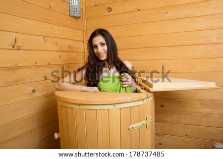 girl in a cedar barrel