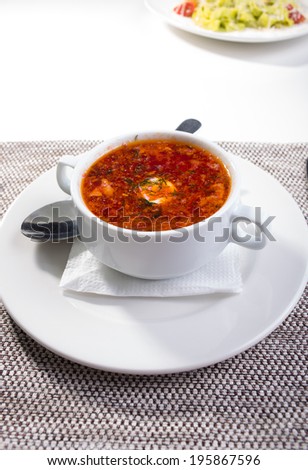 Soup. borscht in a white plate on a light background