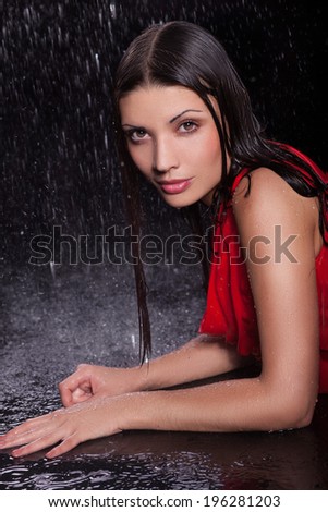 girl in a red dress in the rain