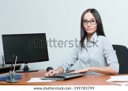 beautiful business woman holding a paper. office employee. smiling