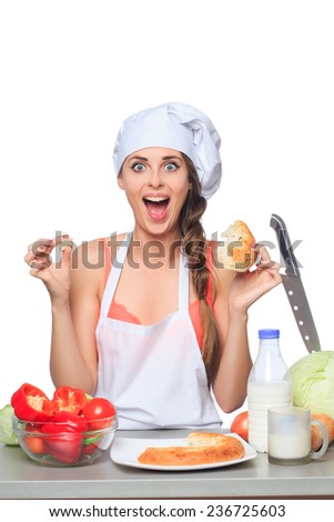 female chef holding a bread with expression