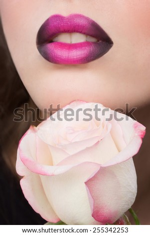Woman face with lilac Lips and Rose Flower.