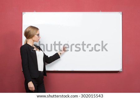 business woman pointing at the whiteboard