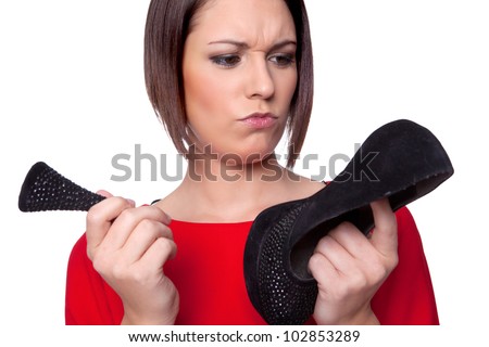 woman is wondering about her broken shoe heel