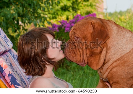Tender Kiss with a Large Dog