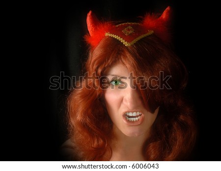Girl wearing a cute devil look for Halloween party