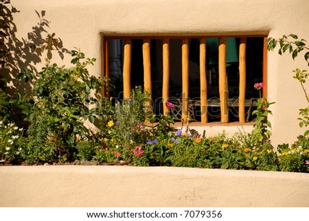 Little cafe behind wooden bars on a street level window in Taos, New Mexico