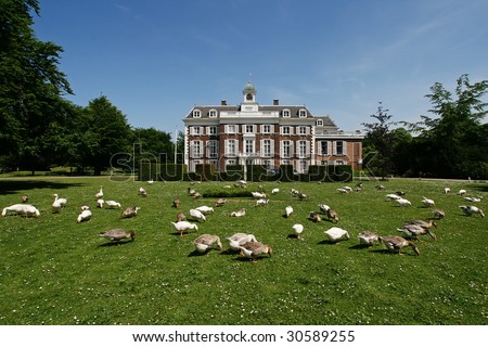 Luxurious traditional mansion in the Netherlands (The Hague, Europe) with geese in the garden