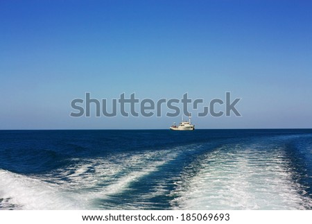 Sport motor boat in the open sea in the morning time