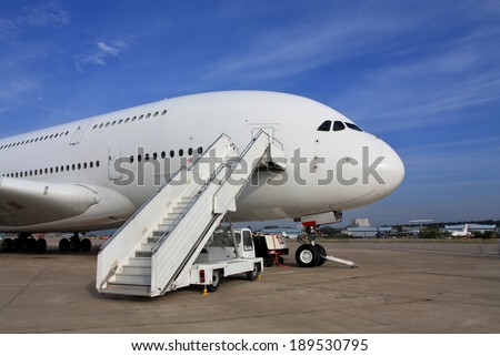Large passenger jet  with attached ladder
