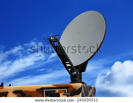 Dish antenna of the military mobile device satellite communication with a metallic reflex reflector in operation