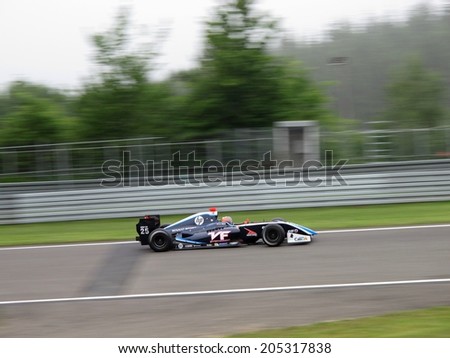NURBURG, GERMANY - JULY 12, 2014: Colombian racing driver Oscar Tunjo (Pons Racing) at full speed in slightly foggy conditions during the World Series by Renault event on July 12, 2014 at Nurburg, Germany.