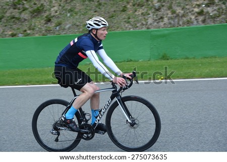 SPA-FRANCORCHAMPS, BELGIUM - APRIL 29: British race car driver Mike Conway (Toyota) on a bicycle before round 2 of the FIA World Endurance Championship on April 29, 2015 in Spa-Francorchamps, Belgium.