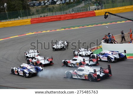 SPA-FRANCORCHAMPS, BELGIUM - MAY 2: The eight leading LMP1 cars in the first corner right after the start of the FIA World Endurance Championship race on May 2, 2015 in Spa-Francorchamps, Belgium.