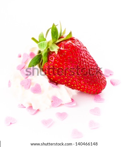 Funny ripe strawberry on clean white background, decorated with love candy. Close up.