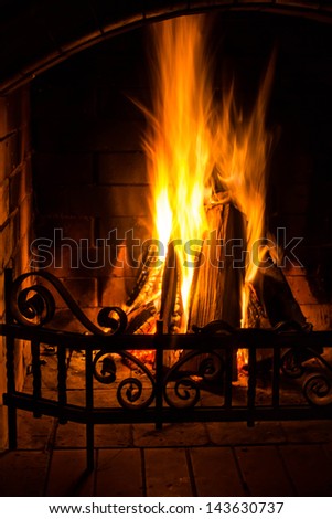 Great Home Fire burning in brick fireplace. Seasonal and holiday fire, Closeup